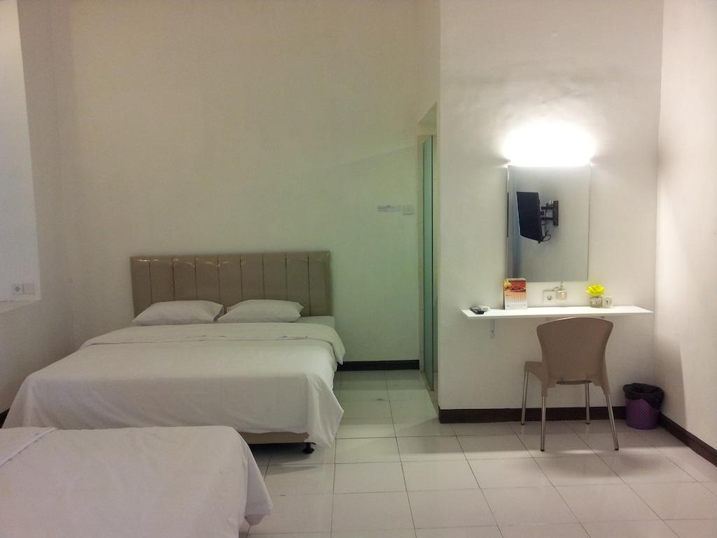 Loxy Inn Surabaya Kamer foto